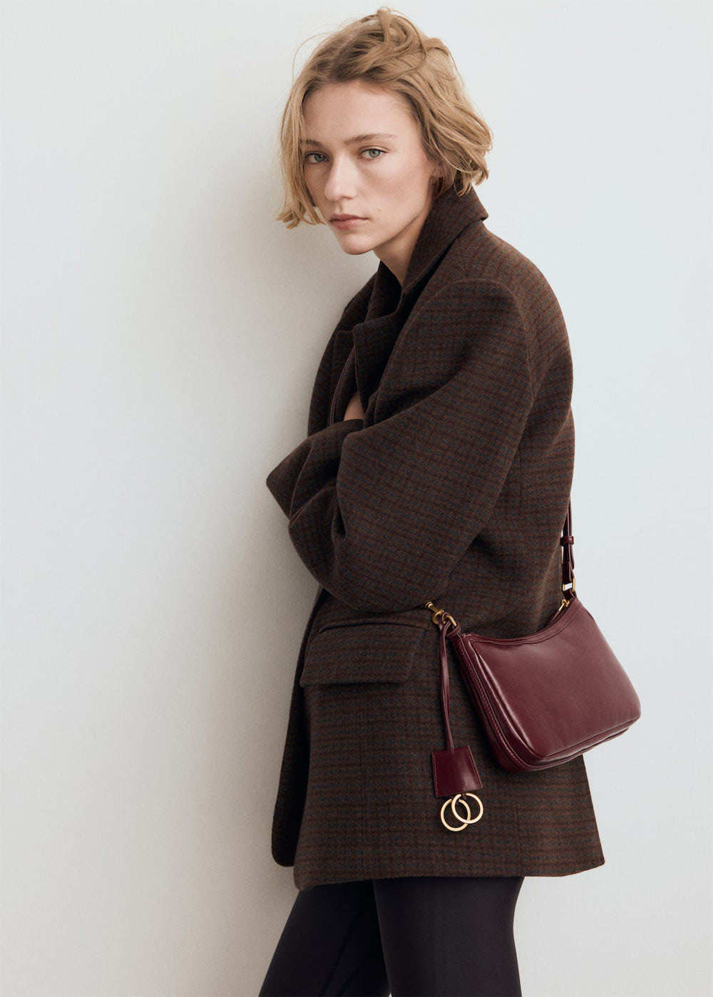 Crossbody bag with charms and rings